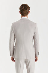 Blazer cruzado para hombre color piedra con estampado de ojo de pájaro.