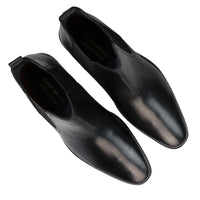 Botas Chelsea negras sin cordones para hombre, de piel auténtica, estilo casual elegante.