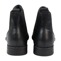 Botas Chelsea negras sin cordones para hombre, de piel auténtica, estilo casual elegante.