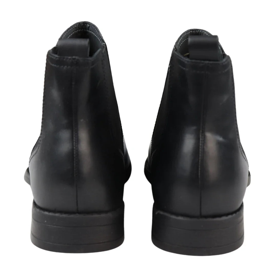 Botas Chelsea negras sin cordones para hombre, de piel auténtica, estilo casual elegante.