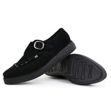 Zapatos de plataforma con hebilla Monk y punta puntiaguda estilo creeper en ante negro.