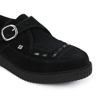 Zapatos de plataforma con hebilla Monk y punta puntiaguda estilo creeper en ante negro.