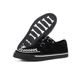 Zapatillas deportivas de plataforma con punta estilo creeper en ante blanco y negro.
