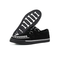 Zapatillas deportivas de plataforma con punta estilo creeper en ante blanco y negro.