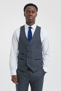 Traje de hombre de 3 piezas azul marino con chaleco cruzado.