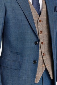 Traje azul marino Viceroy con chaleco de tweed marrón Harris en contraste.