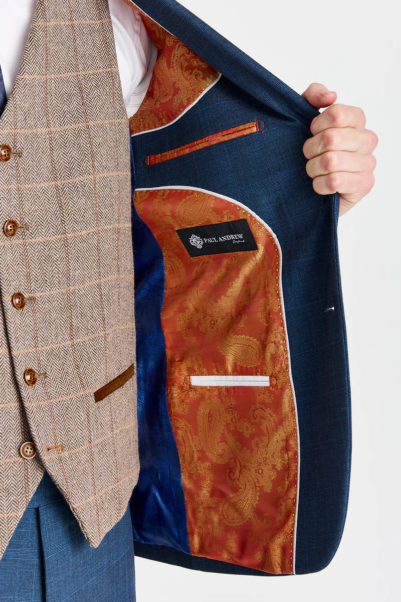 Traje azul marino Viceroy con chaleco de tweed marrón Harris en contraste.