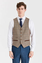 Traje azul marino Viceroy con chaleco de tweed marrón Harris en contraste.