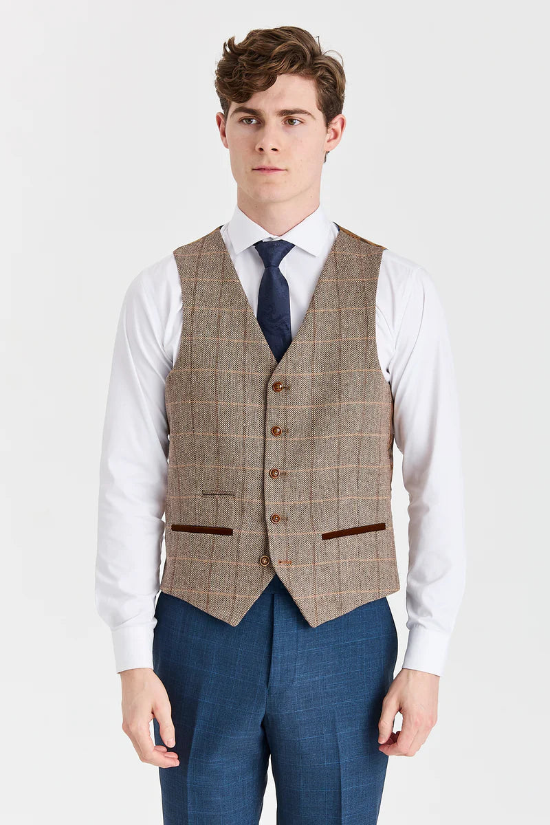 Traje azul marino Viceroy con chaleco de tweed marrón Harris en contraste.
